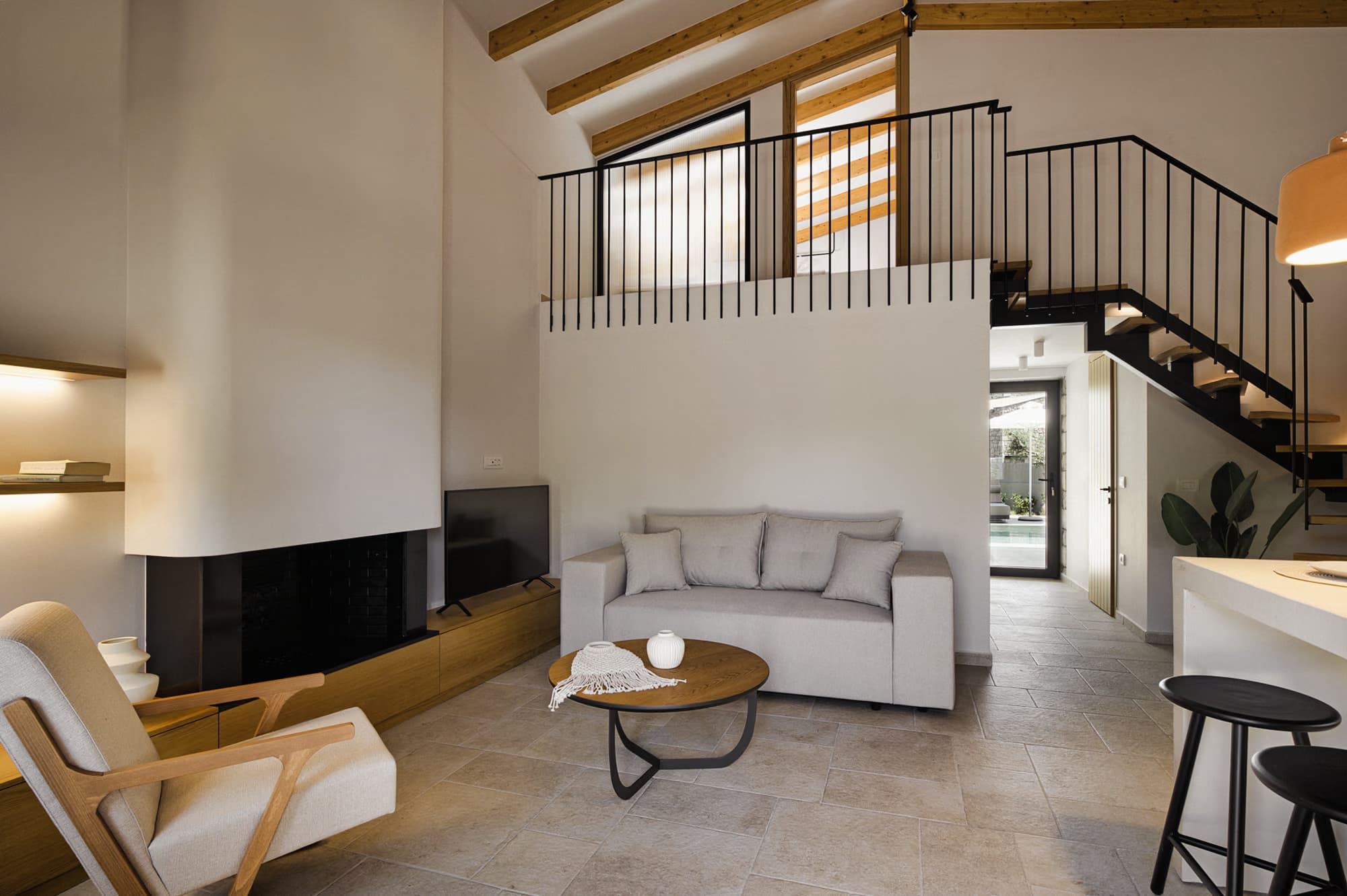 Revello Villa 1 lounge with the loft staircase above