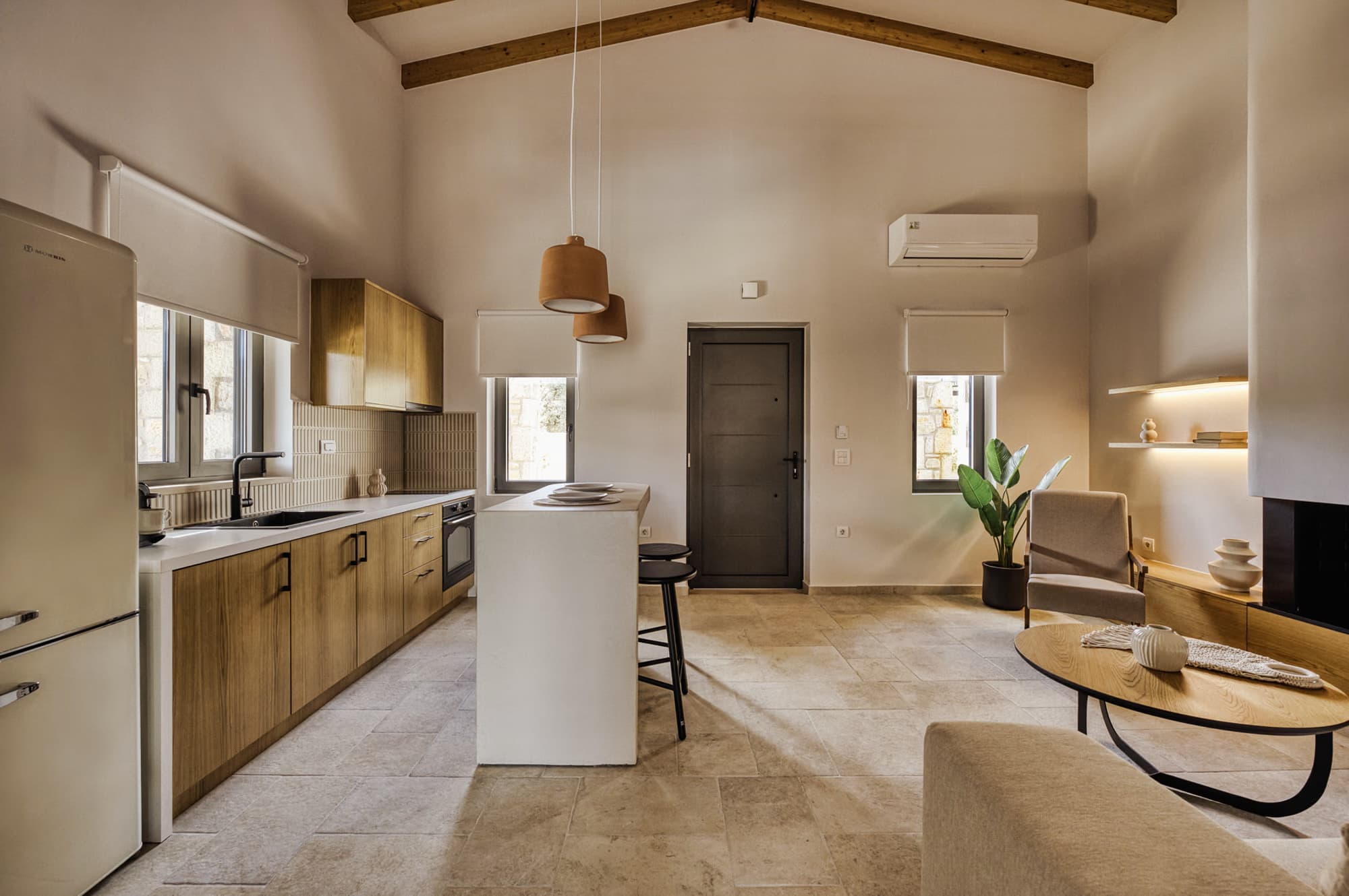 Revello Villa 1 kitchen and living area in warm oak