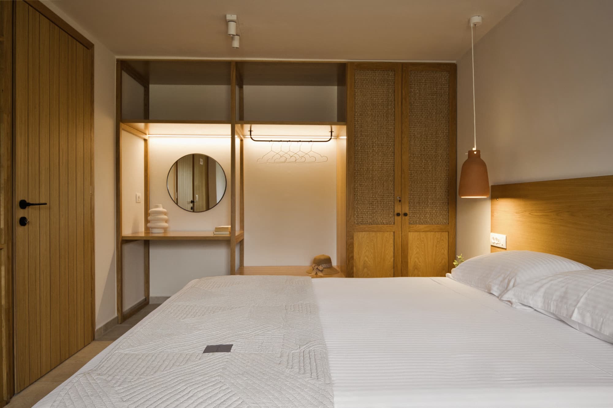 Revello Villa 1 queen bedroom with oak wardrobe and pendant light