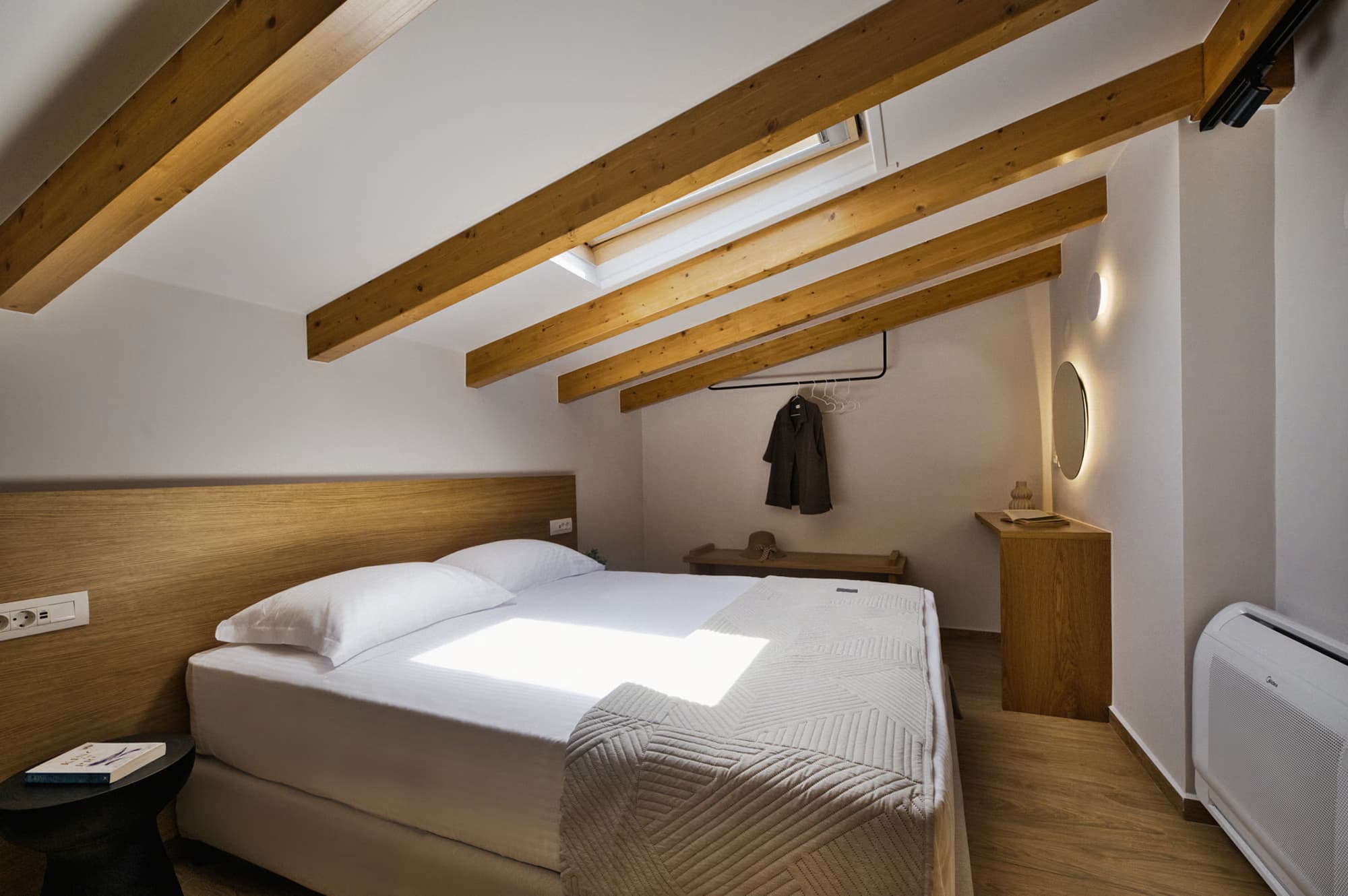 Revello Villa 1 queen bed beneath timber roof beams