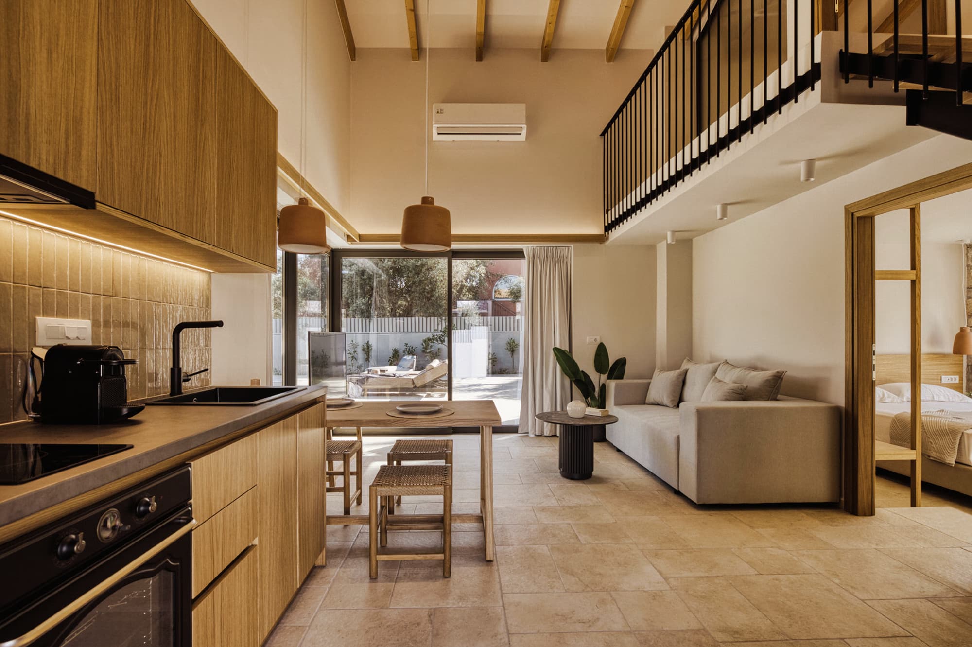 Revello Villa 2 oak kitchen opening onto the living area