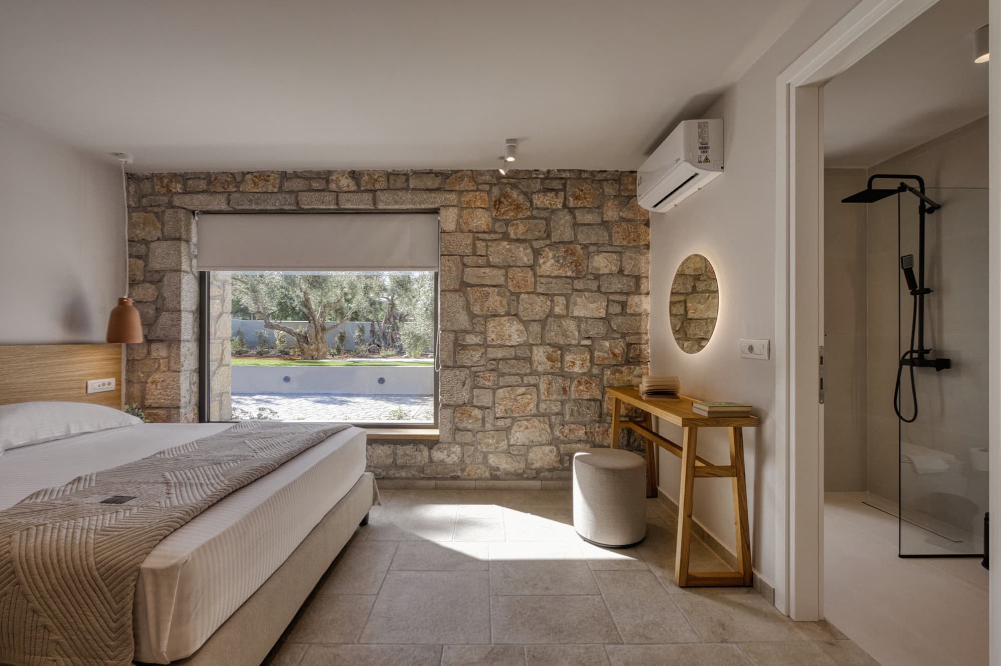 Revello Villa 2 stone-walled bedroom with garden view