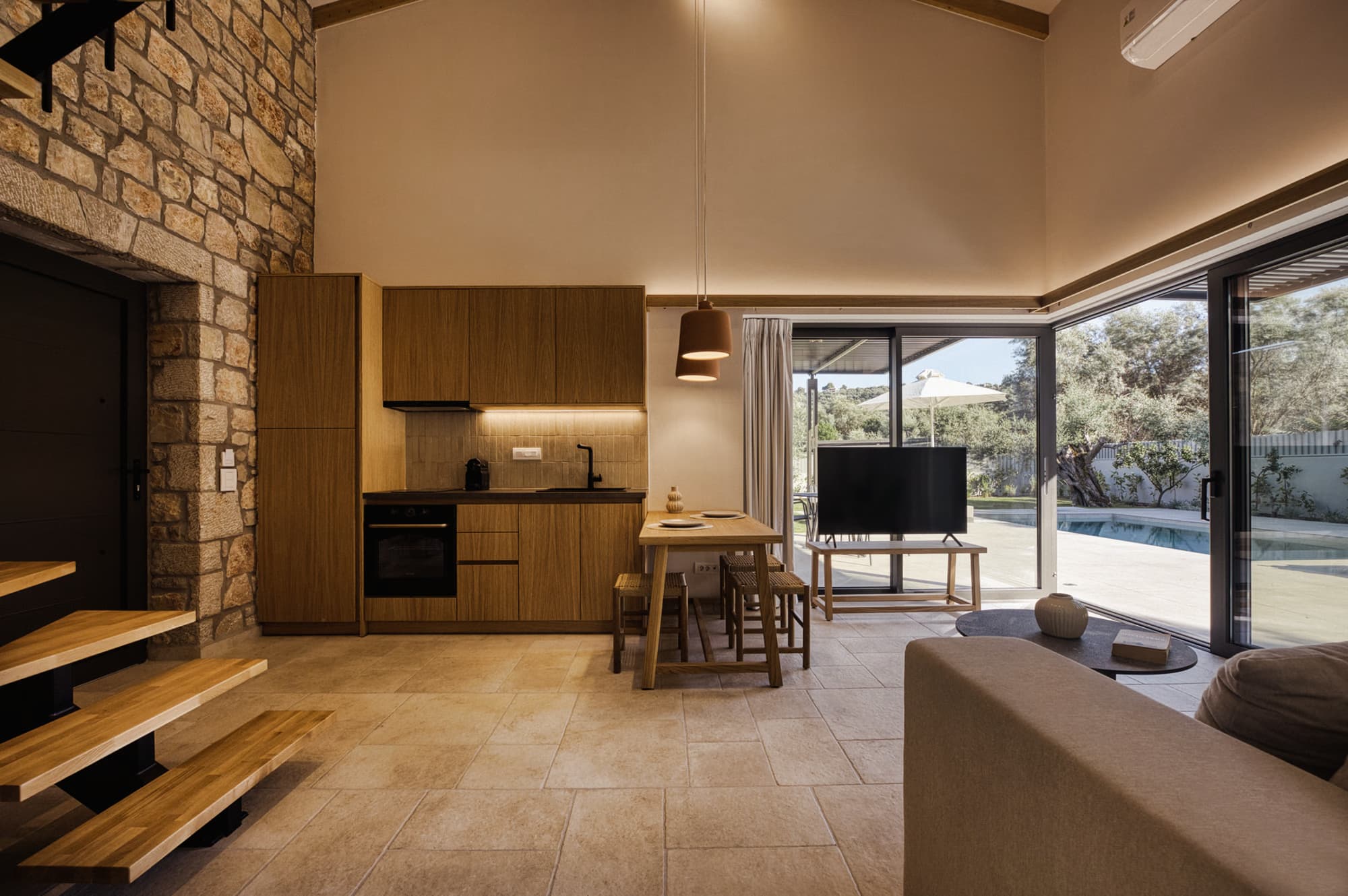 Revello Villa 2 kitchen and dining beside the loft staircase