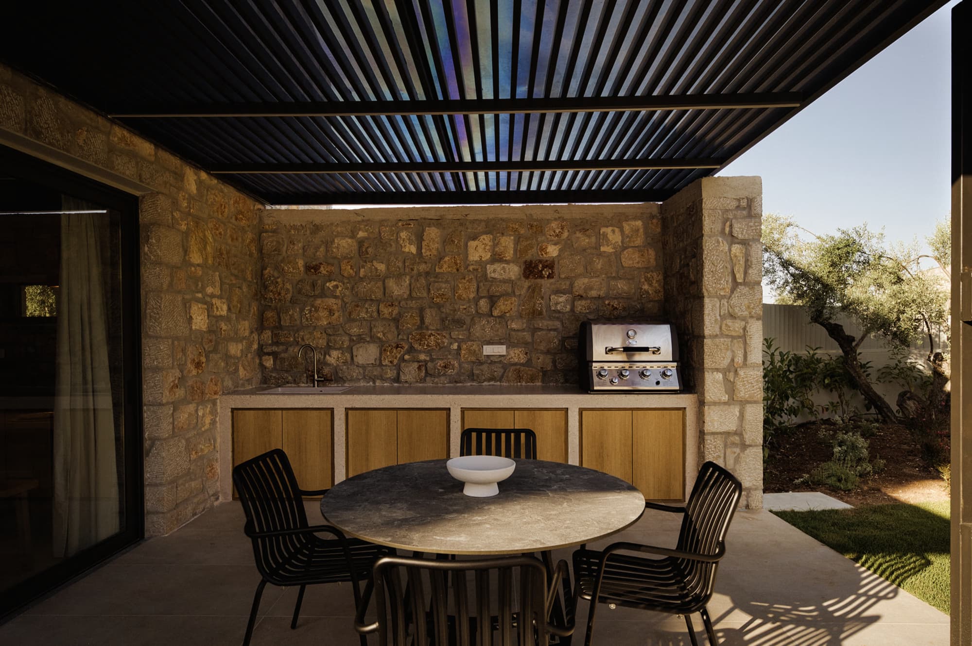 Revello Villa 2 outdoor dining and BBQ under the pergola