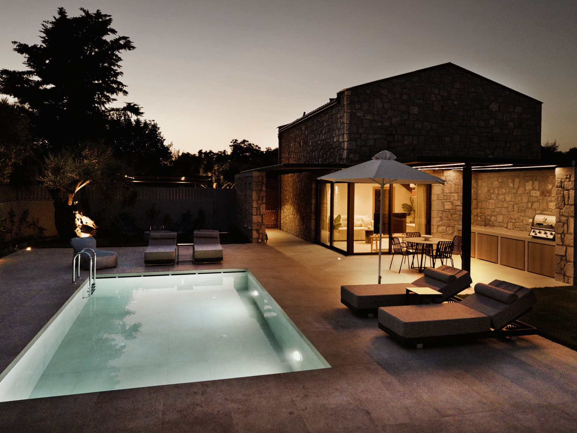Revello Villa 2 pool and loungers at twilight