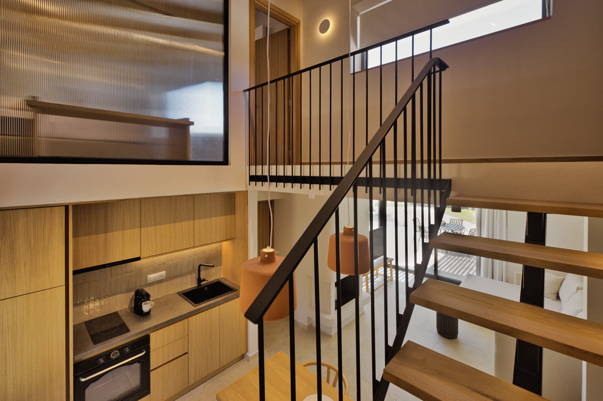 Revello Villa 3 kitchen beside the black steel stair