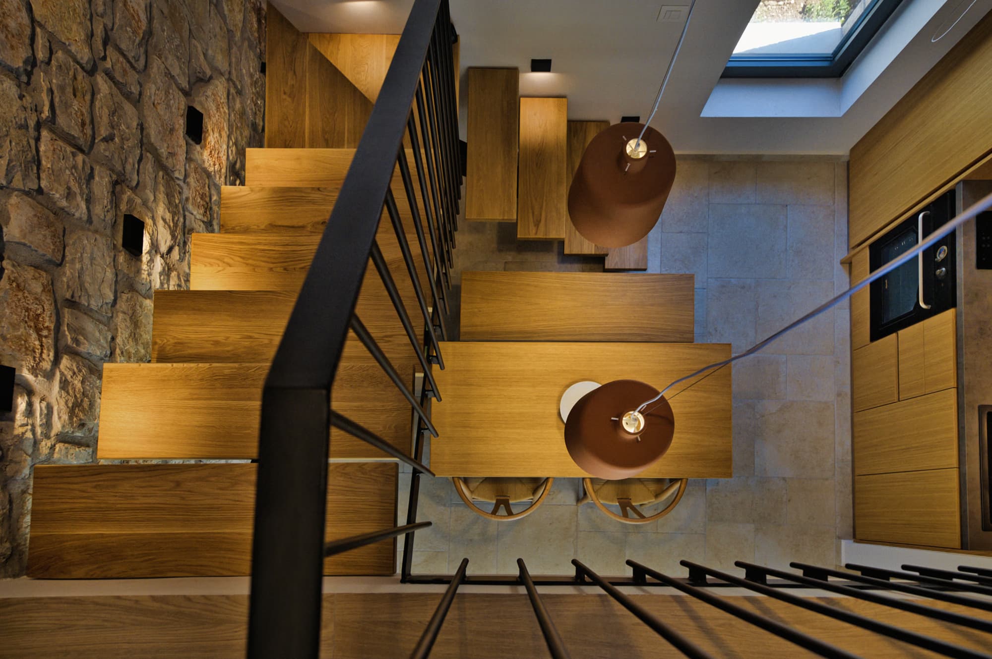 Revello Villa 3 staircase and dining seen from the mezzanine
