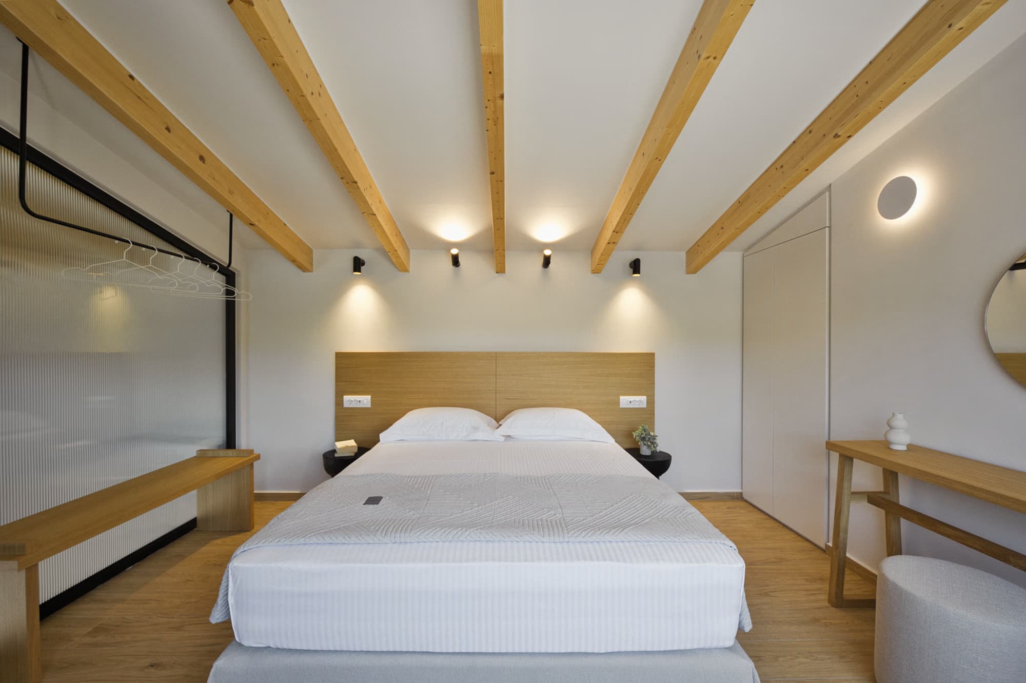 Revello Villa 3 queen bed beneath timber roof beams