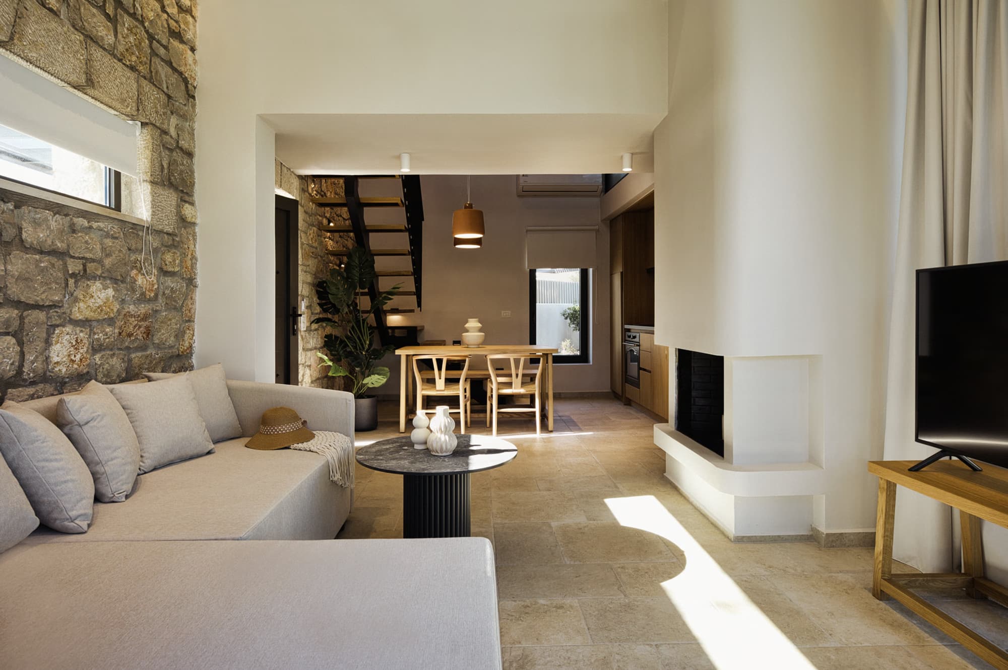 Revello Villa 4 living and dining room with loft staircase