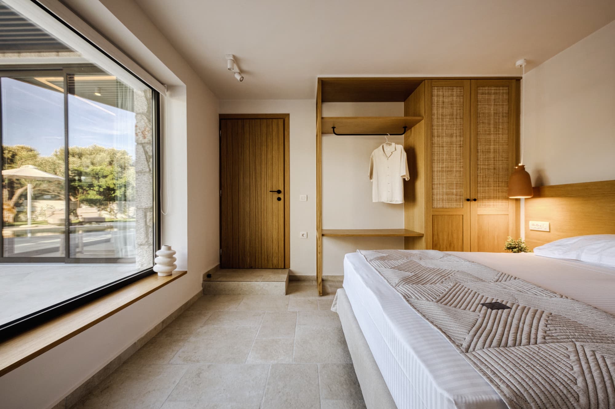 Revello Villa 4 bedroom with a window to the pool terrace