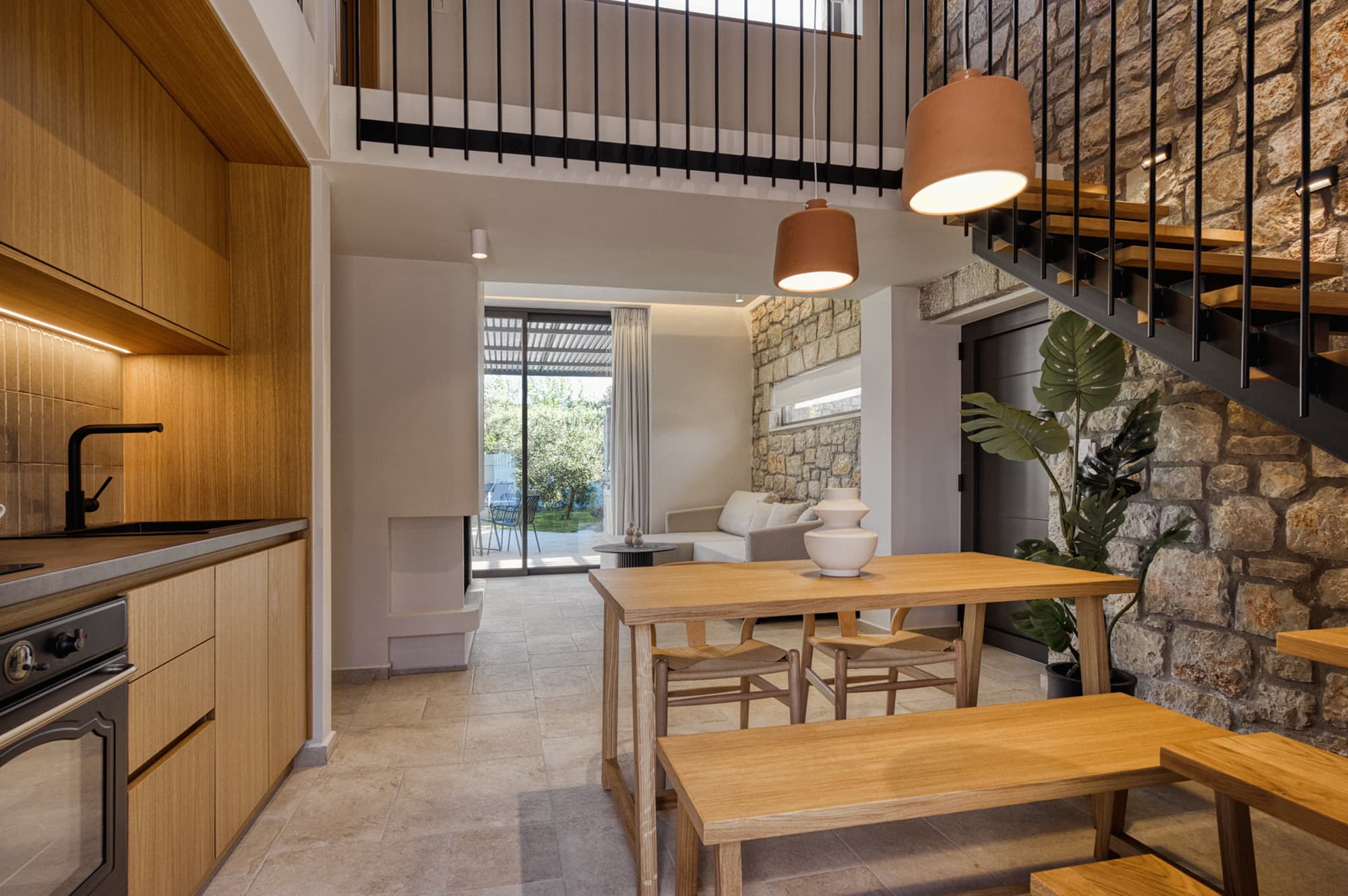Revello Villa 4 oak kitchen and dining beneath the mezzanine