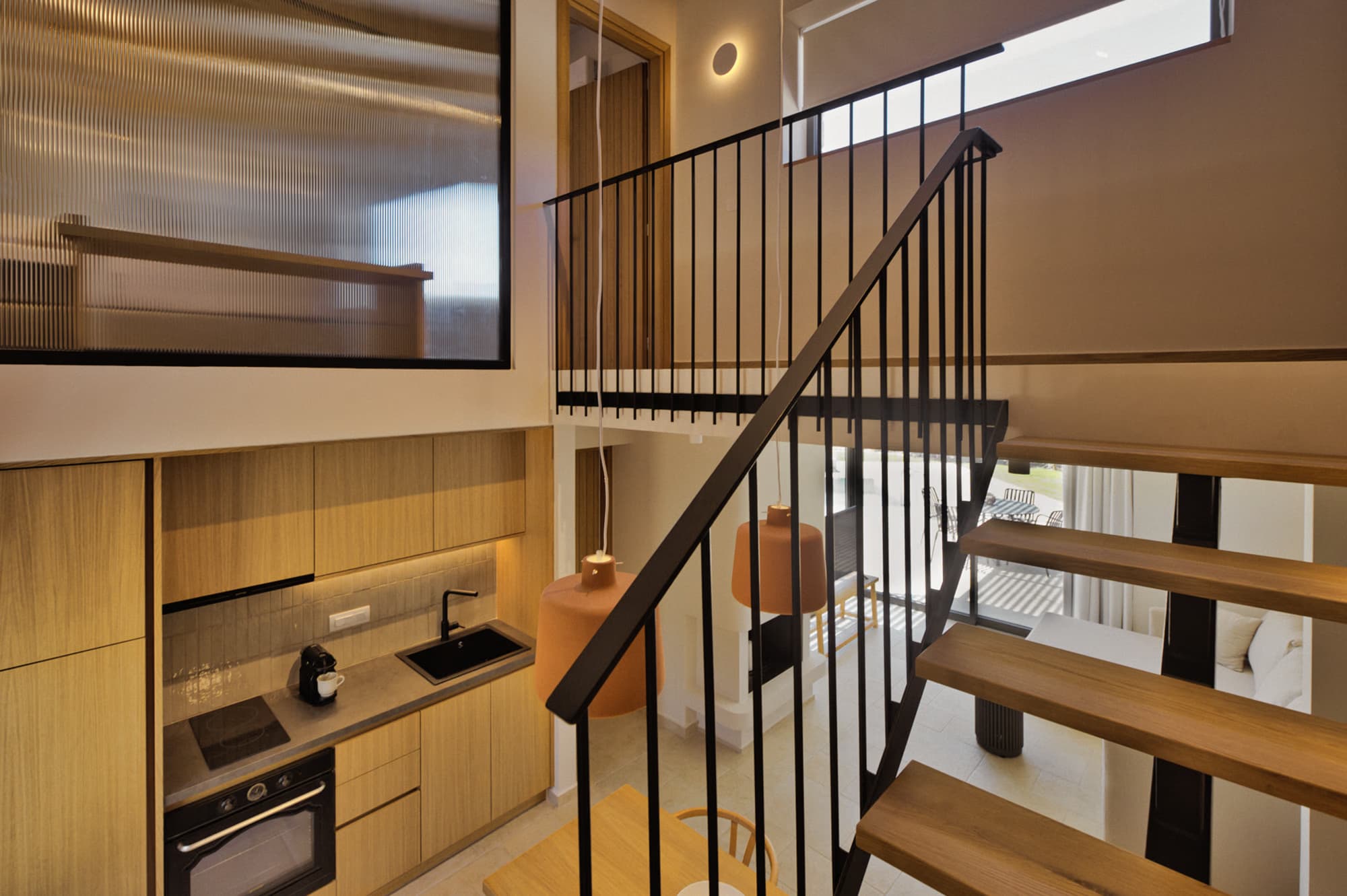 Revello Villa 4 kitchen seen from the loft staircase
